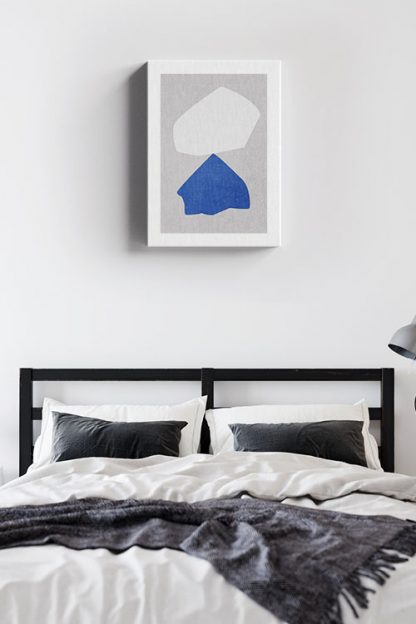 Blue and white rock balance canvas in interior