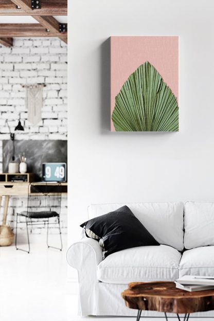 Dry palm leave on pink background canvas in interior