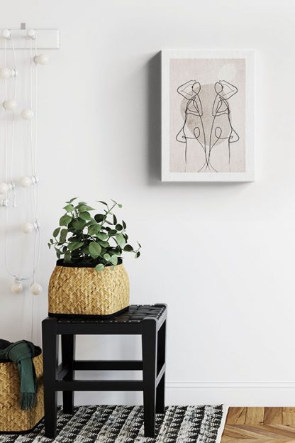 Abstract figure of a woman and shape canvas in interior