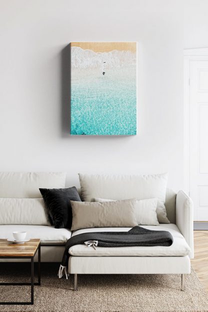 Bird flying on shore canvas