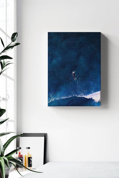 Surfing on a dark blue sea canvas