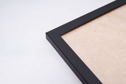 Black frame with cardboard in close up view