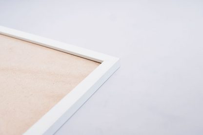 A white frame with cardboard in a close-up view